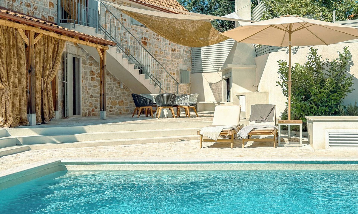 Dol Villa | Modern expression of a traditional Hvar stone house amidst sunny nature.