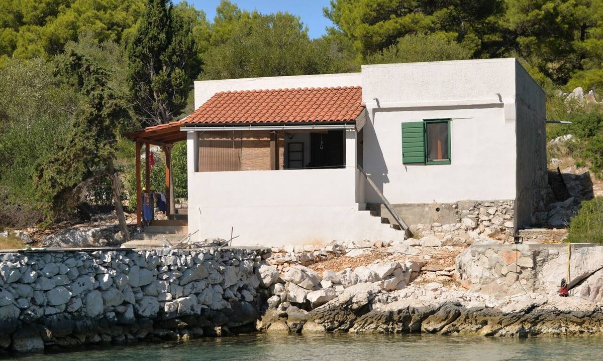 Kornati House | Steinhaus am Meer mit überdachter Terrasse als p by Interhome