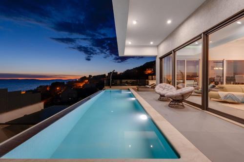 Jesenice Villa | Villa Grey with 4 bedrooms, Heated pool, Sauna, Media room, Sea Views