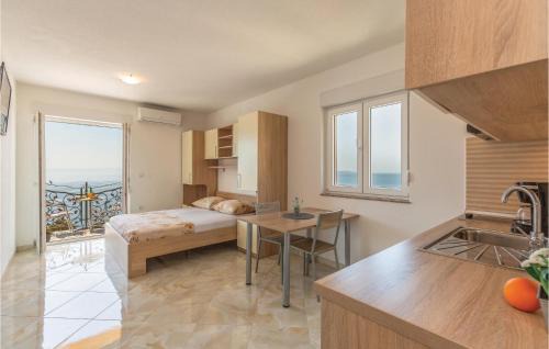 Bratus Apartment | Beach Front Apartment In Krvavica With Wifi