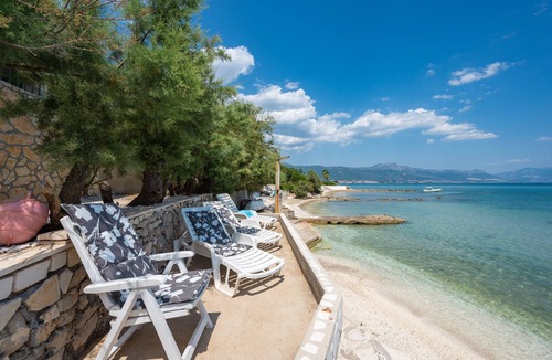 Trogir Villa | Beachfront villa Mihovil with direct beach access, garden, pool and mooring