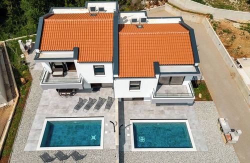 Risika House | Beautiful villa with a pool, ocean view, and sandy beach by TRAVELER Tourist Agency Krk