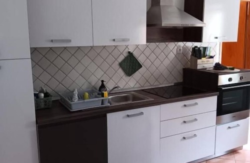 Kobarid Apartment | Comfortable one-bedroom apartment in Drežnica near Kobarid, featuring a fully equipped kitchen, free WiFi, air conditioning, and beautiful mountain surroundings.