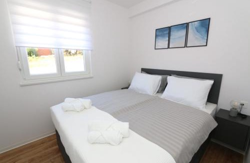 Kolan Apartment | Dolphin view II with a pool by the beach