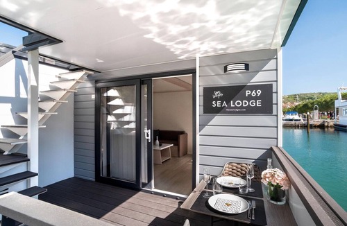 Seca Boat Rental | Dreamy houseboat by the sea with terrace and hot tub