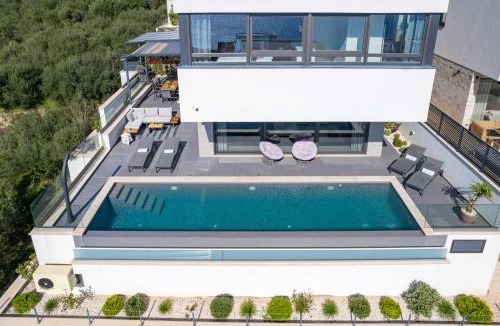 Jesenice Villa | Villa Grey with 4 bedrooms, Heated pool, Sauna, Media room, Sea Views