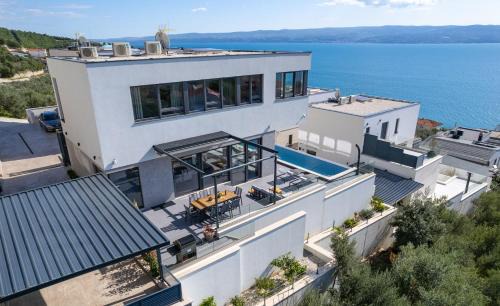 Jesenice Villa | Villa Grey with 4 bedrooms, Heated pool, Sauna, Media room, Sea Views