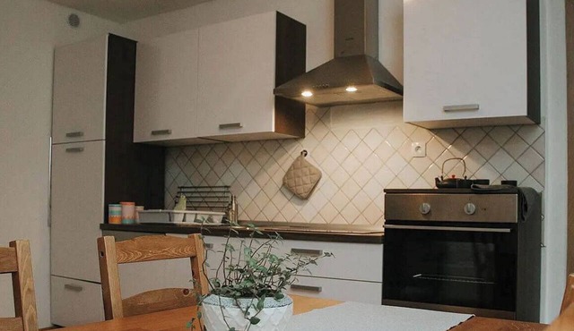 Comfortable one-bedroom apartment in Drežnica near Kobarid, featuring a fully equipped kitchen, free WiFi, air conditioning, and beautiful mountain surroundings.