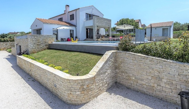 Luxury villa with infinity swimming pool, outdoor jacuzzi and garden in Sveti Lovrec