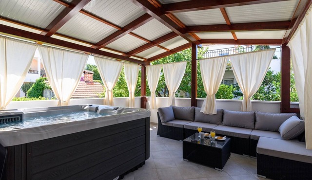 Two bedroom apartment with hot tub by the beach Arbanija, Čiovo (A-16762-a) in Trogir