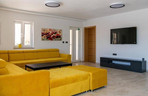 Kozljani House | Enjoy a relaxing time in this modern vacation home with pool.