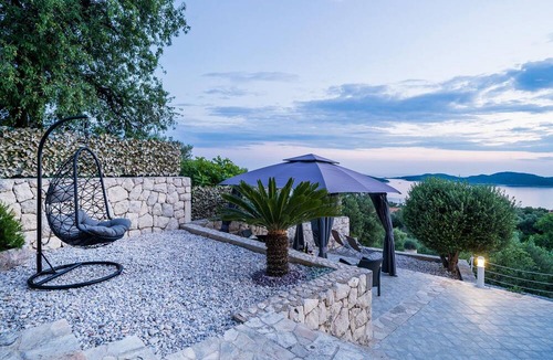 Brsecine House | This beautiful stone house consists of three units connected by external stairs.