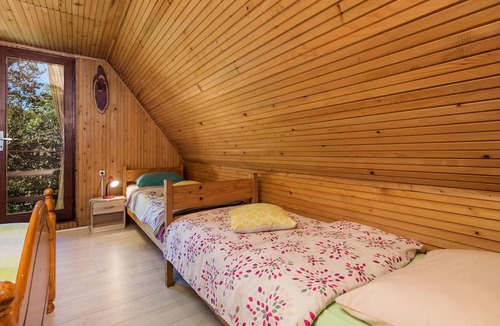 Zlobin House | Surrounded by pine trees is this small cottage.